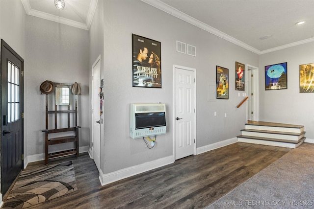 entrance foyer featuring ornamental molding, dark wood-type flooring, and heating unit