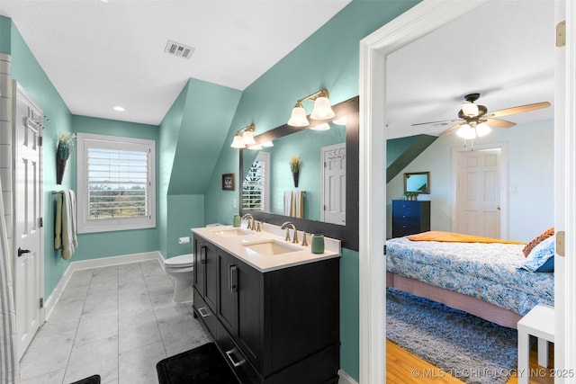 bathroom with ceiling fan, toilet, and vanity