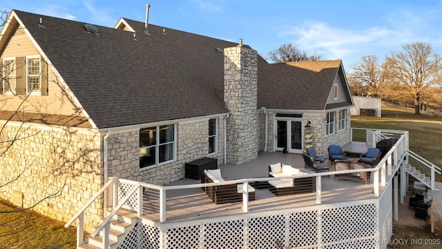 rear view of house with a wooden deck