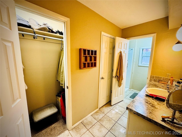 bathroom featuring vanity and tile patterned flooring