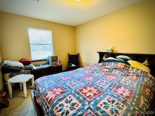 bedroom featuring carpet