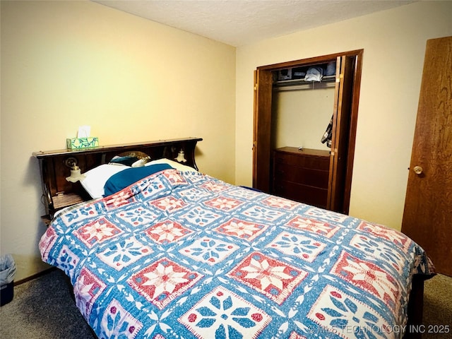 bedroom featuring a textured ceiling, a closet, and carpet flooring