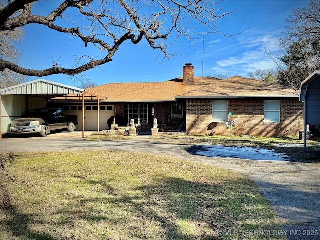 ranch-style house featuring a front lawn and a carport