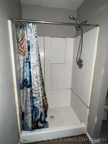 bathroom featuring walk in shower