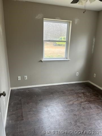 unfurnished room with ceiling fan