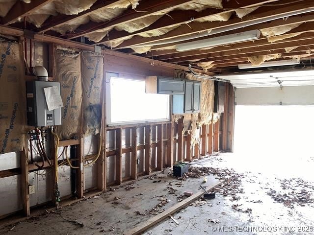 misc room featuring water heater