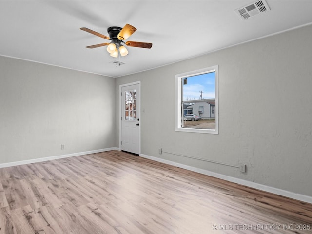 spare room featuring ceiling fan and light wood-type flooring