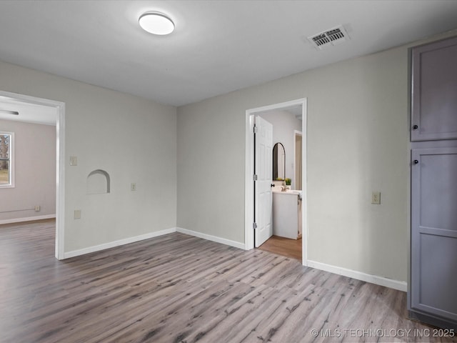 unfurnished room featuring light hardwood / wood-style flooring