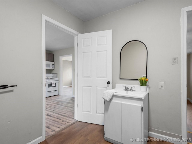 bathroom featuring vanity and hardwood / wood-style flooring