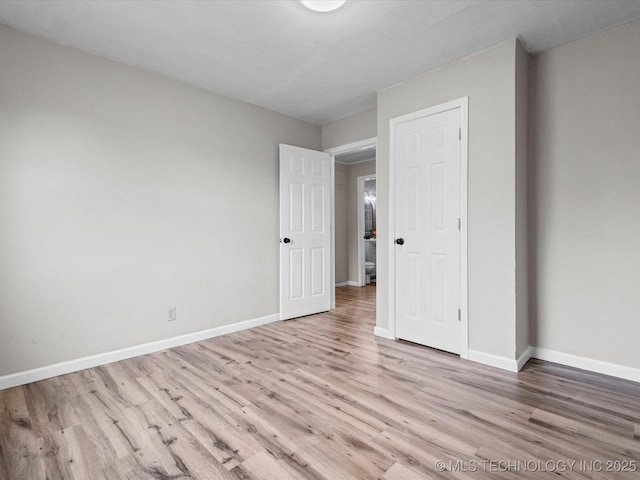 unfurnished bedroom with light hardwood / wood-style flooring