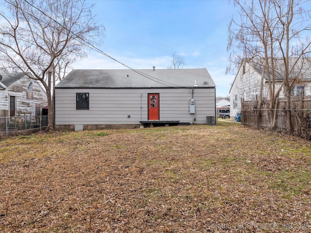 rear view of property featuring central AC