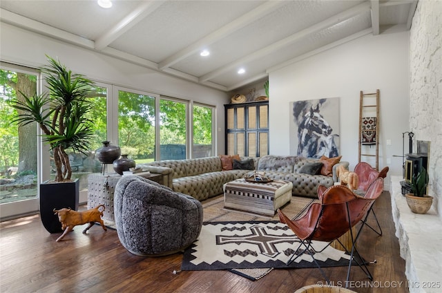 living room featuring vaulted ceiling with beams, dark hardwood / wood-style floors, and plenty of natural light