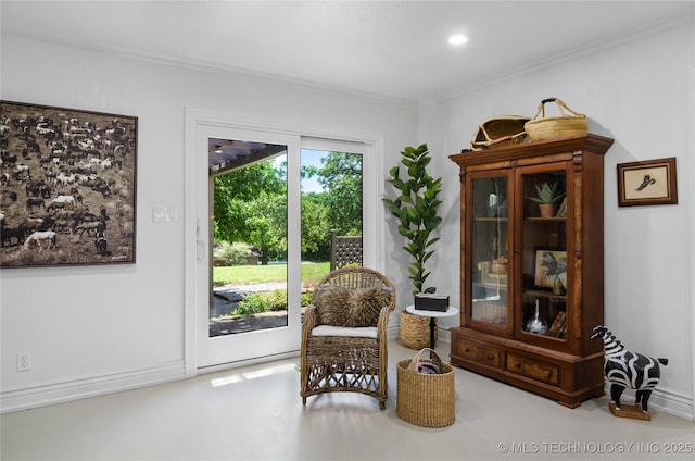 living area featuring ornamental molding