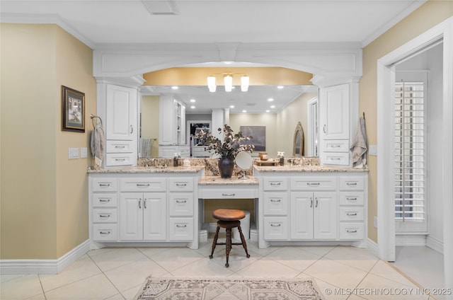 bathroom featuring tile patterned flooring, vanity, and ornamental molding