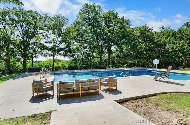 view of pool with a patio