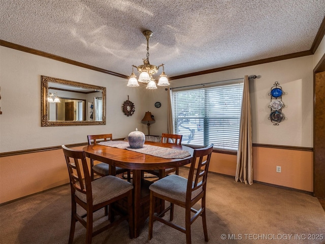 carpeted dining room featuring ornamental molding, a textured ceiling, and an inviting chandelier