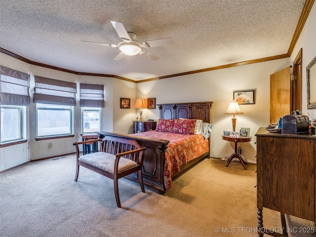 bedroom featuring a textured ceiling, light colored carpet, ceiling fan, and ornamental molding