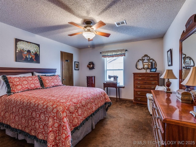 carpeted bedroom featuring ceiling fan and a textured ceiling