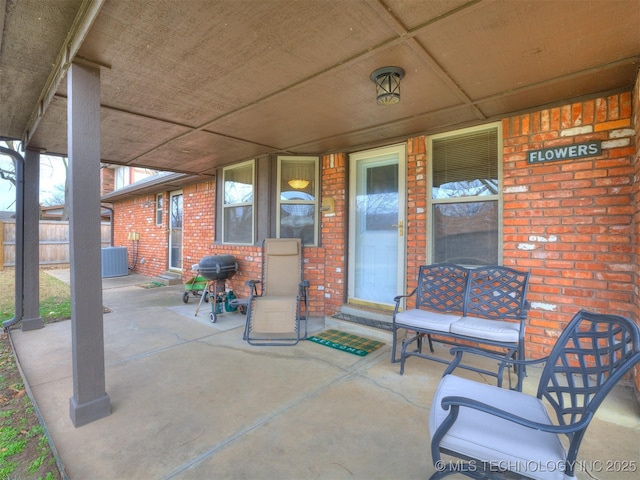 view of patio / terrace with area for grilling and central AC unit