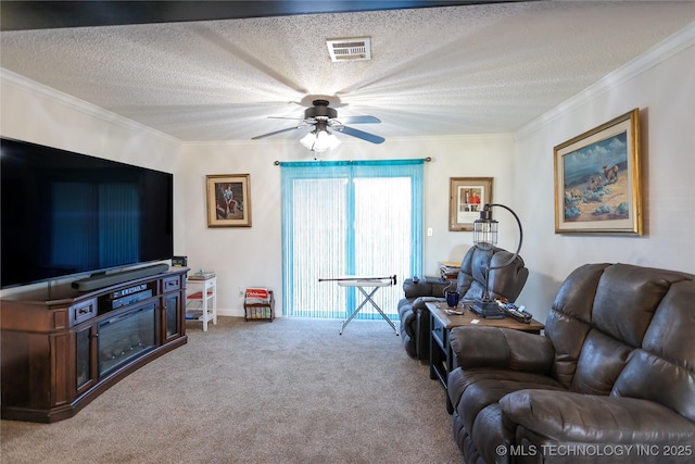 carpeted living room featuring a textured ceiling, ceiling fan, and crown molding