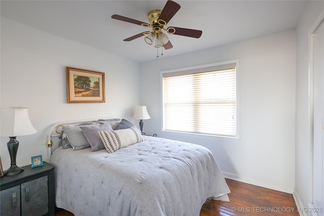 bedroom featuring dark hardwood / wood-style flooring and ceiling fan