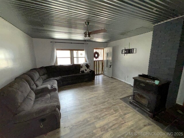 living room with hardwood / wood-style floors and ceiling fan