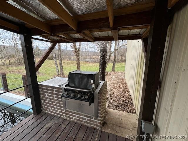 wooden deck featuring an outdoor kitchen