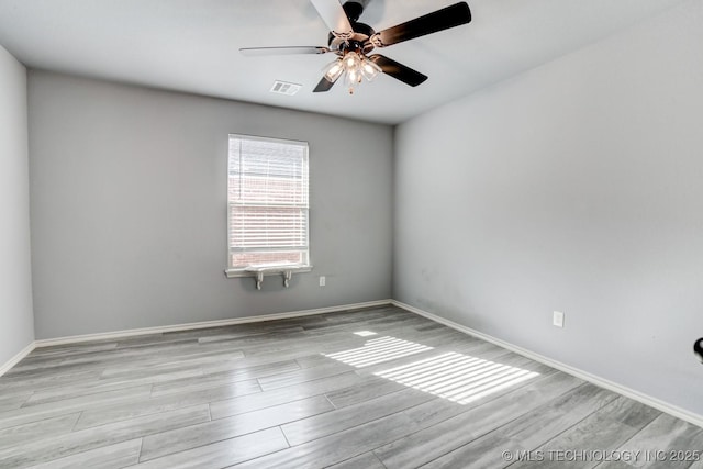 unfurnished room featuring ceiling fan and light wood-type flooring