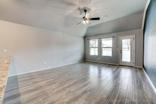 unfurnished room featuring ceiling fan and lofted ceiling