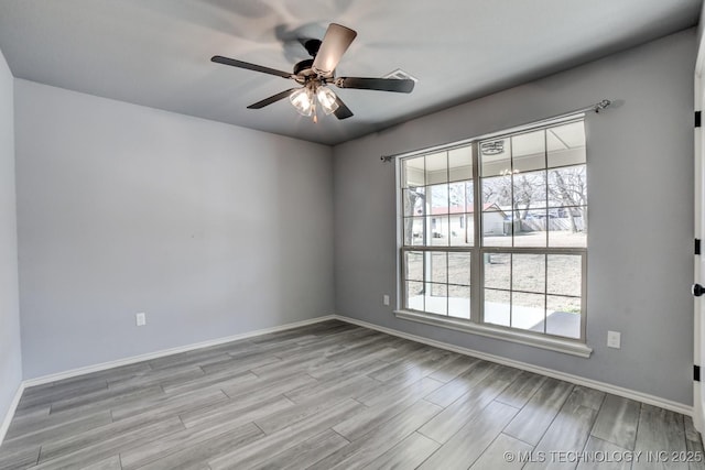 unfurnished room featuring ceiling fan and light hardwood / wood-style floors