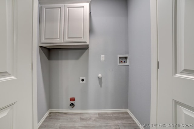 washroom with cabinets, hookup for a washing machine, gas dryer hookup, and electric dryer hookup