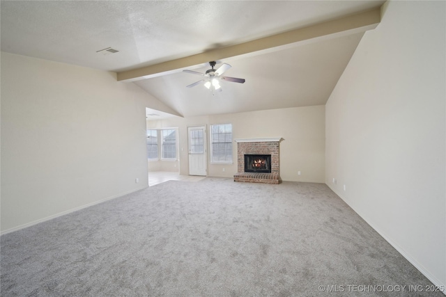 unfurnished living room featuring carpet flooring, a brick fireplace, a textured ceiling, ceiling fan, and vaulted ceiling with beams