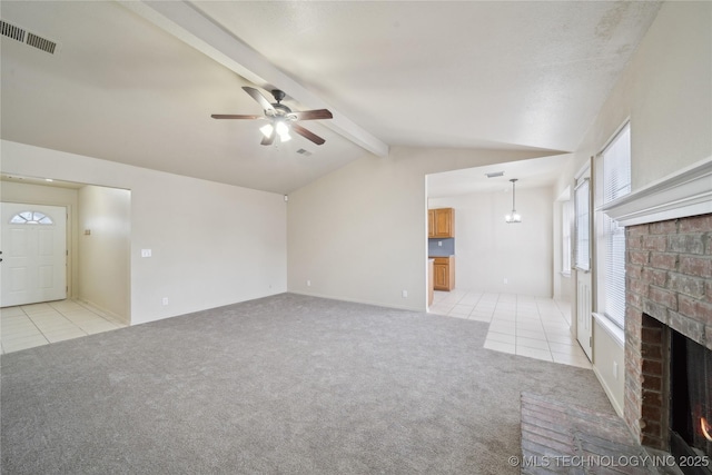 unfurnished living room featuring light carpet, a fireplace, ceiling fan, and lofted ceiling with beams