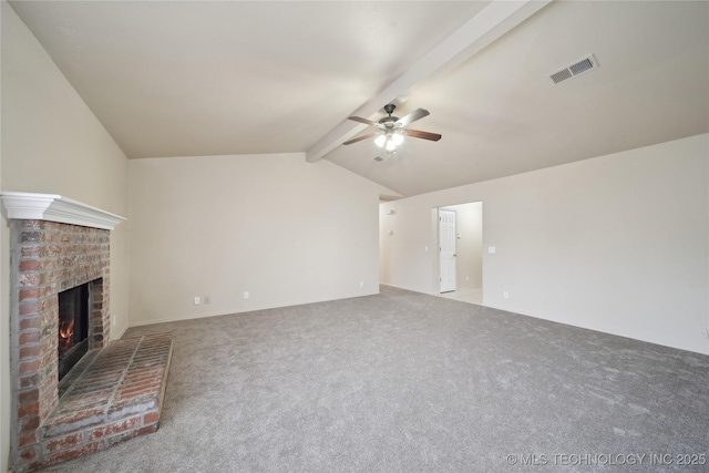 unfurnished living room with carpet, lofted ceiling with beams, a fireplace, and ceiling fan