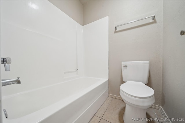 bathroom with tile patterned flooring and toilet