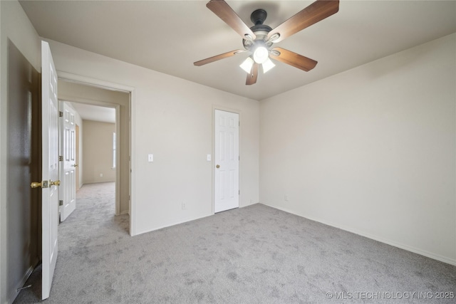 unfurnished bedroom featuring ceiling fan and light colored carpet