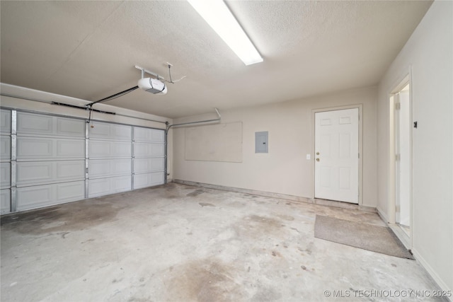 garage featuring electric panel and a garage door opener