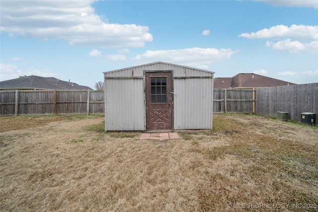 view of outbuilding with a yard