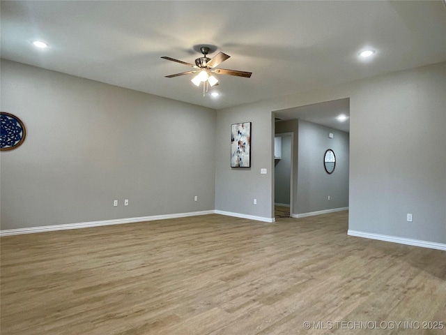 empty room with light wood-type flooring and ceiling fan