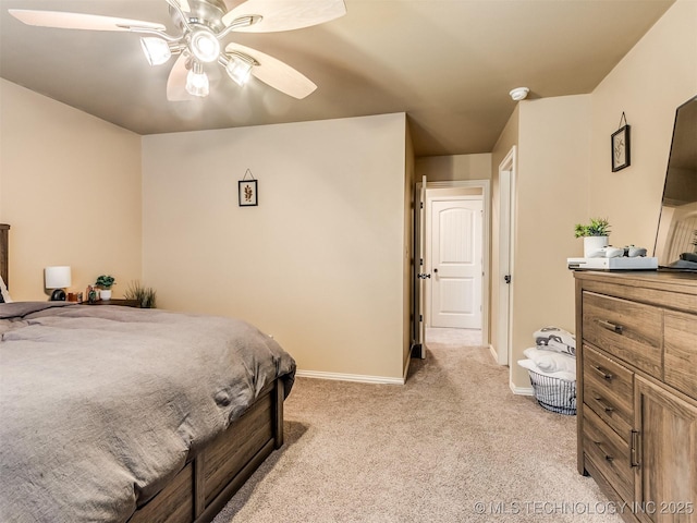 bedroom with ceiling fan and light carpet