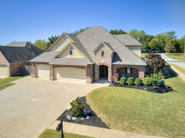 view of front of house with a garage and a front lawn