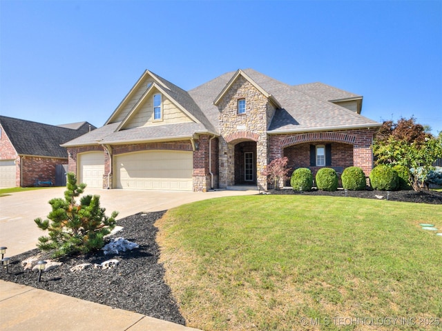 view of front of house featuring a garage, concrete driveway, stone siding, roof with shingles, and brick siding