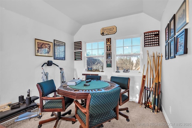 recreation room with light colored carpet and lofted ceiling