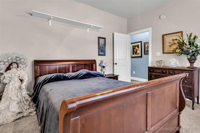 bedroom with light colored carpet