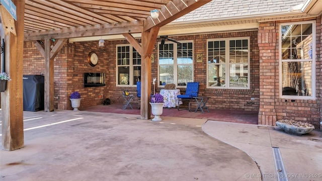 view of patio with a pergola and grilling area