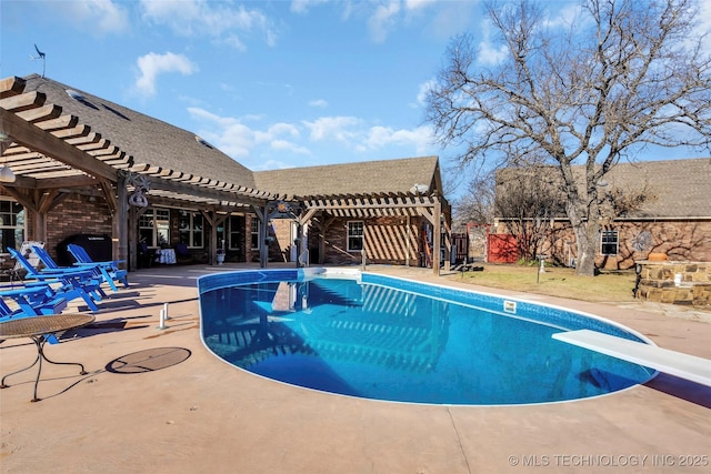 view of pool with a pergola, a diving board, and a patio area