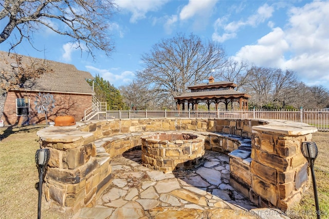 view of patio with a gazebo and a fire pit