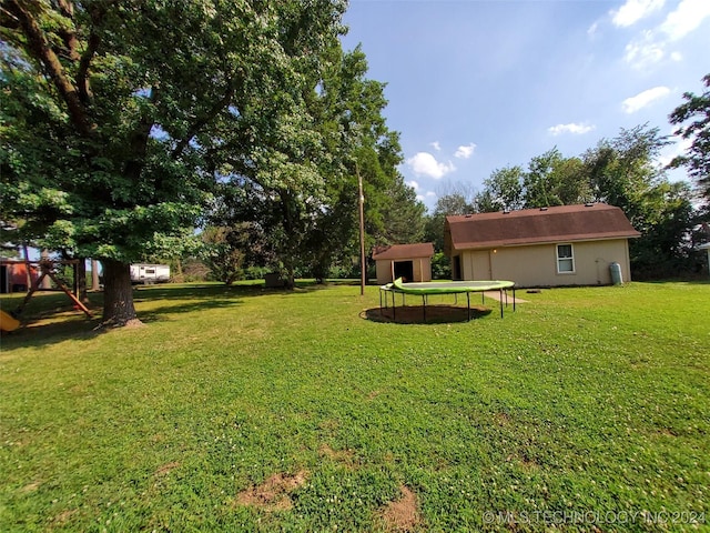 view of yard with a trampoline