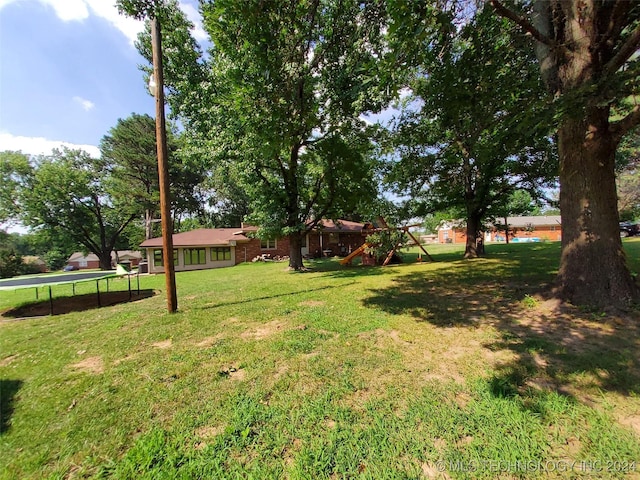 view of yard with a trampoline