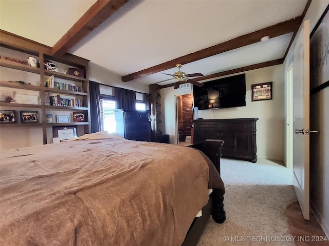 bedroom with carpet flooring, beam ceiling, and ceiling fan